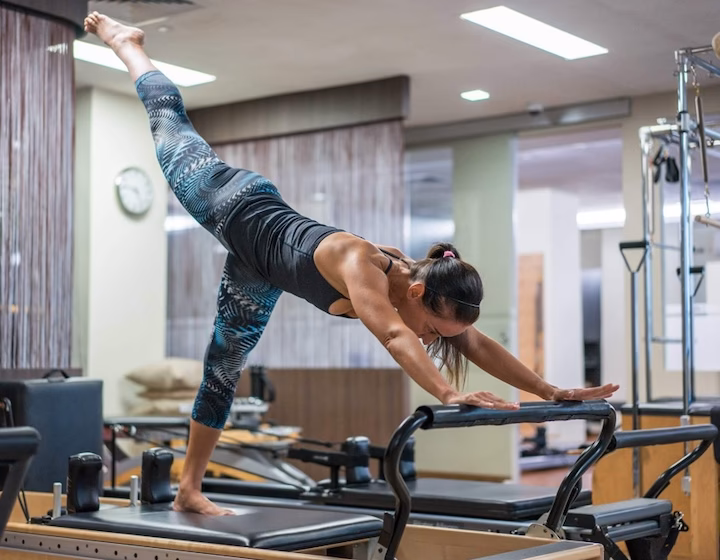 How do I become a certified Pilates instructor in Singapore?
