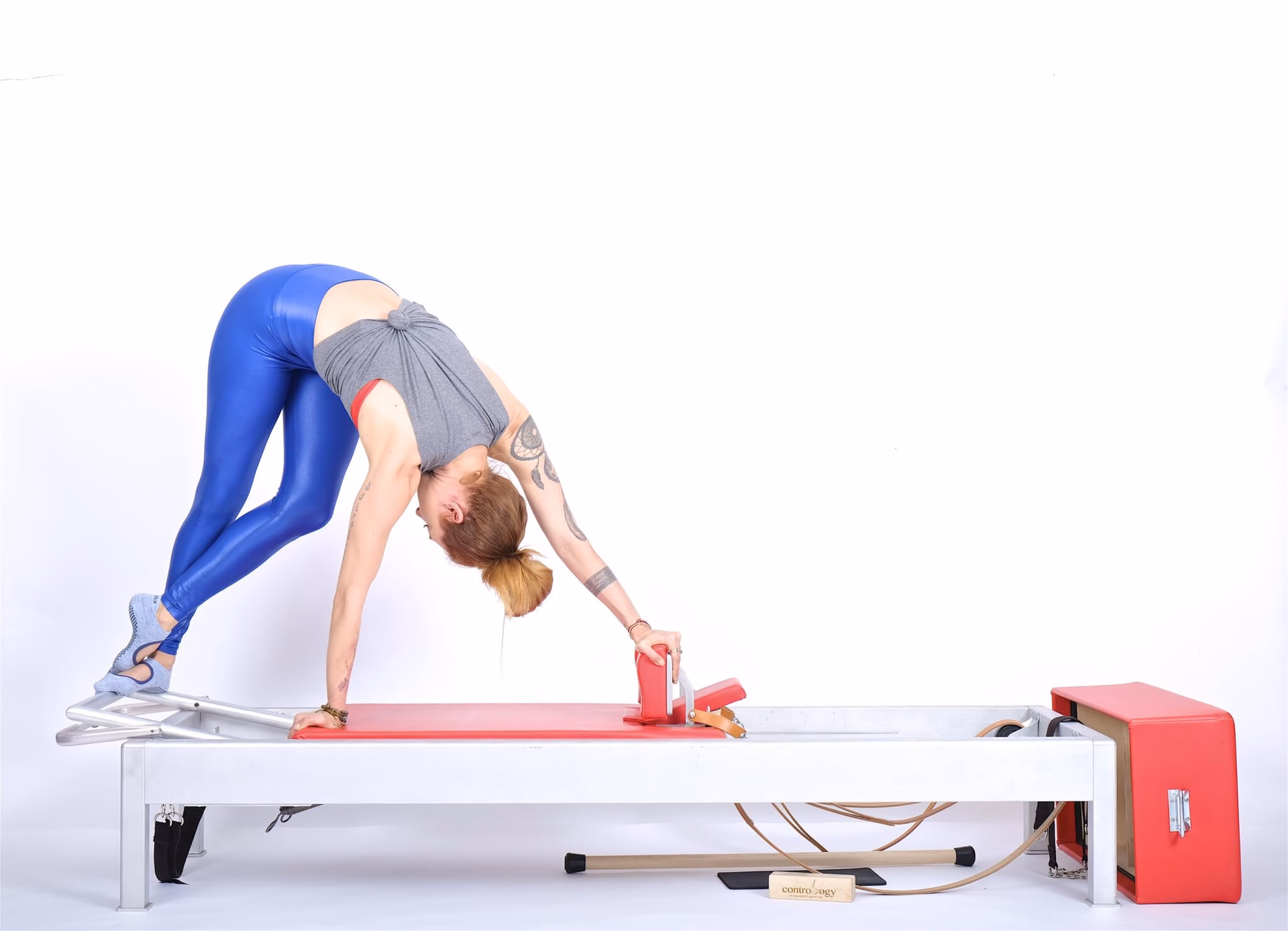 What is the purpose of the spine twist in Pilates?