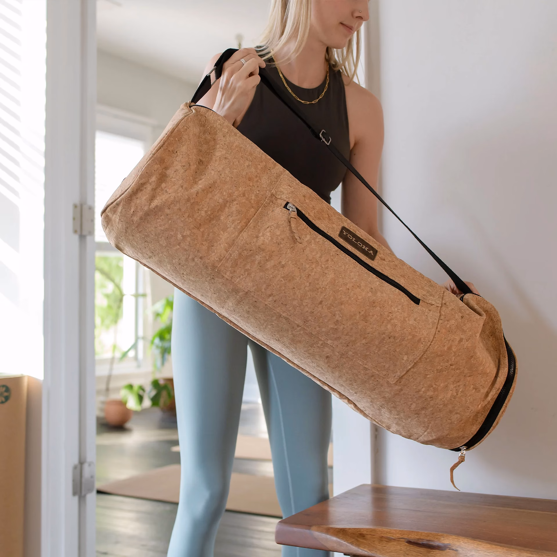 What is the best way to transport a yoga mat?